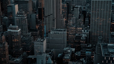 Dense cityscape with tall buildings at dusk